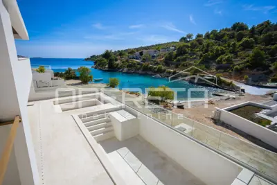 Newly built spacious villa in the first row by the sea and a quiet bay