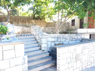 Part of a house with a yard, Otok Brač - stone facade and separate entrance - 3